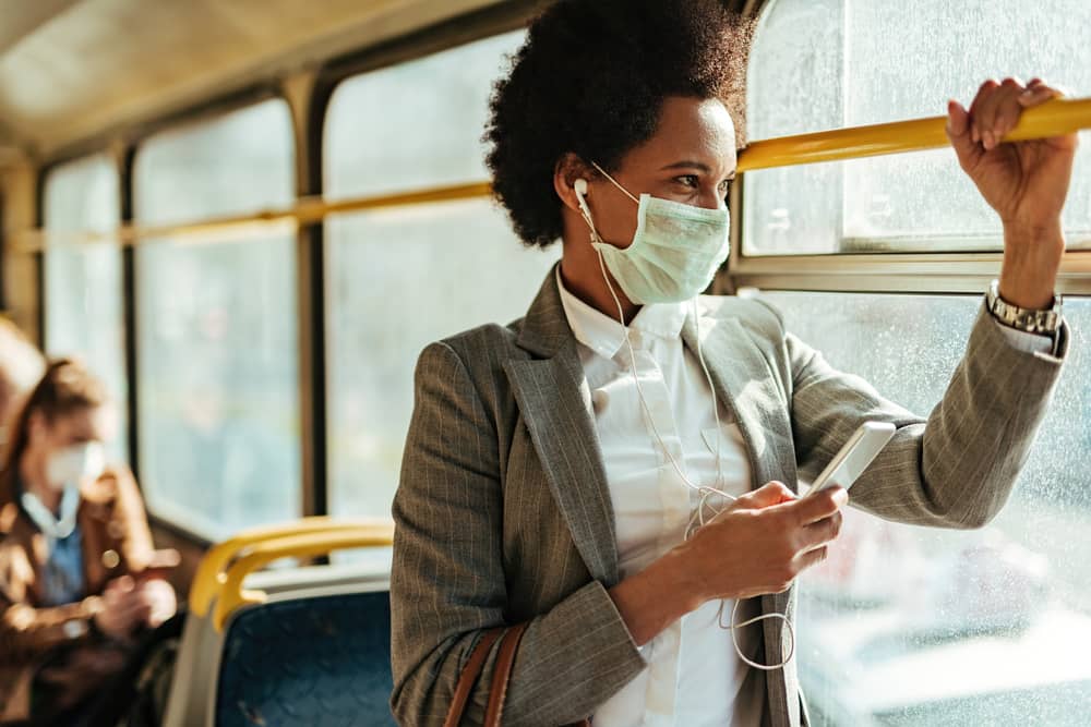 Woman wearing mask on public bus